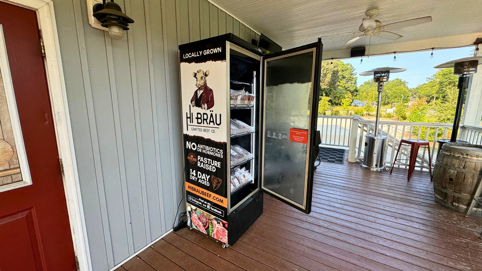 The Hi Bräu smart freezer on a porch in Newberry