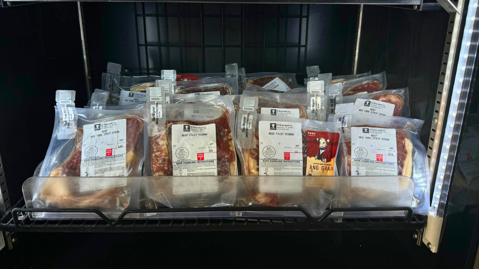 Vacuum-sealed Hi Bräu cuts on the freezer shelf